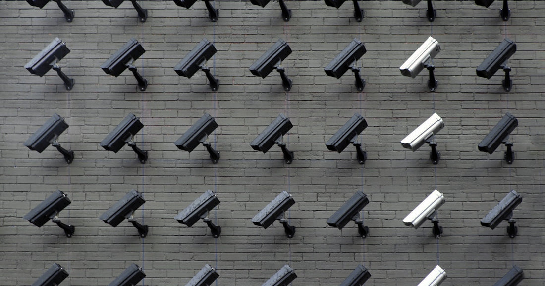 Security camera mounted on building